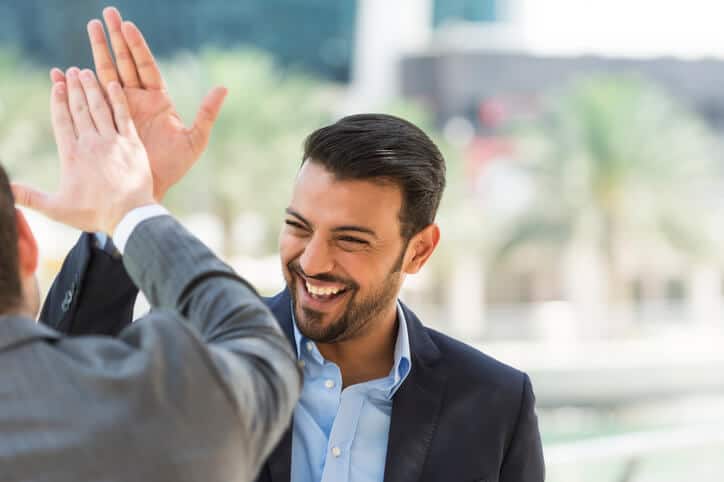 Individuals celebrate after completing accent reduction classes